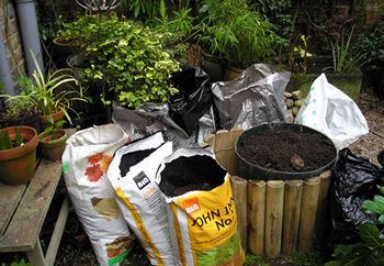 Plastic sacks full of soil, filling Kitchen Corner